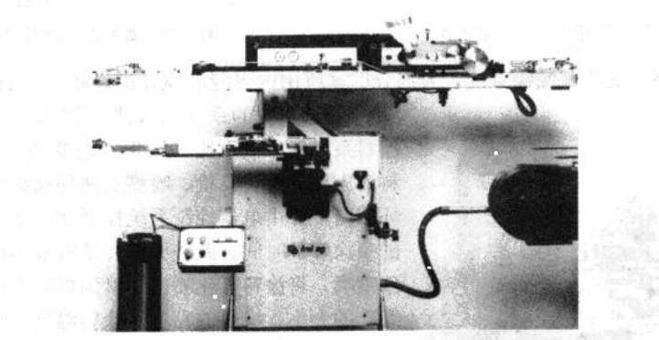 Figure 3‑67 Internal roller coating device, including the coating arm, can conveyor, paint container, and control system.